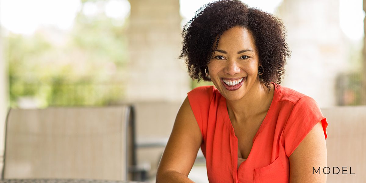 African-American Female with Toned Arms Sitting at Home